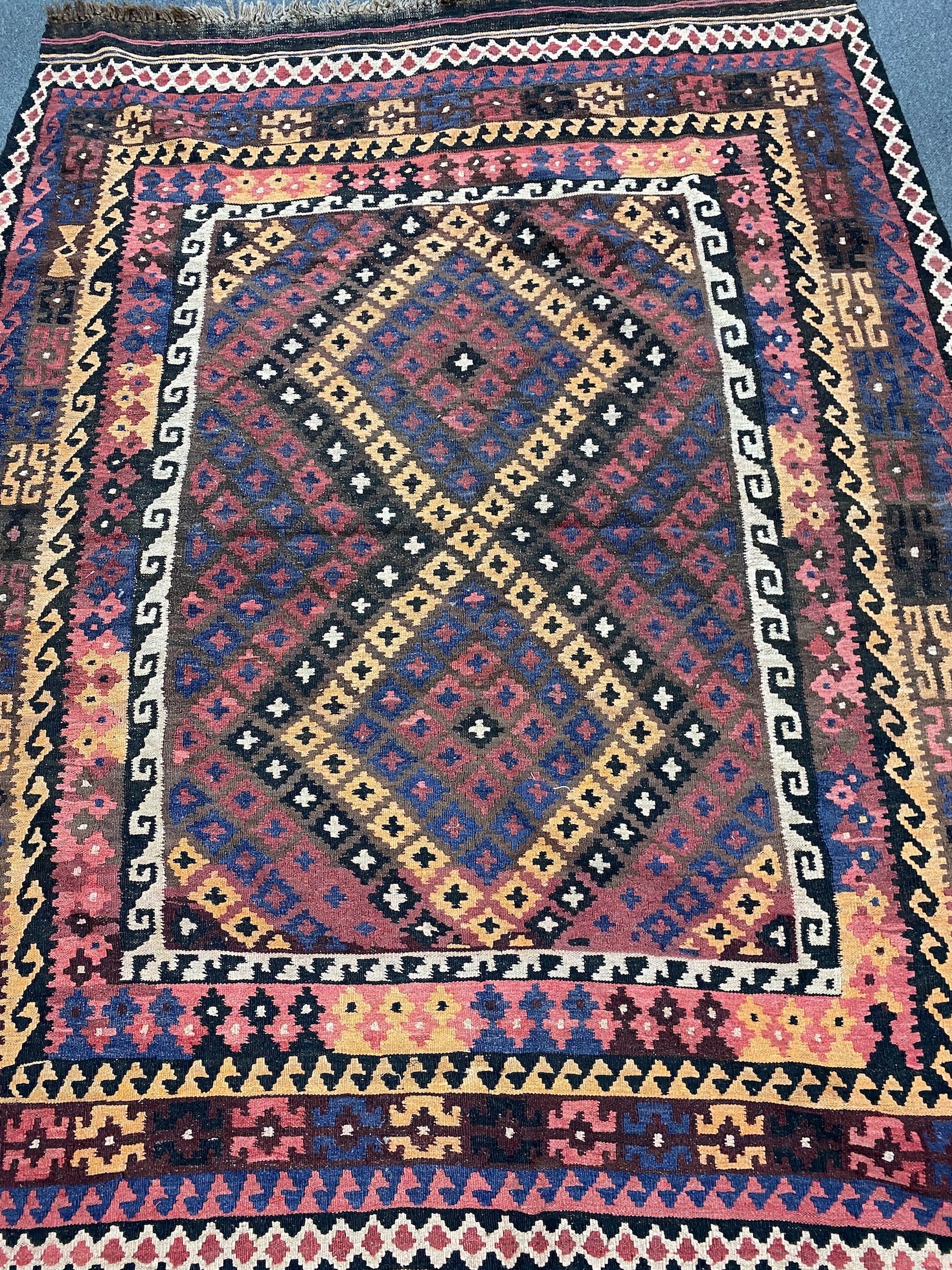A polychrome flatweave rug, 203 x 160cm